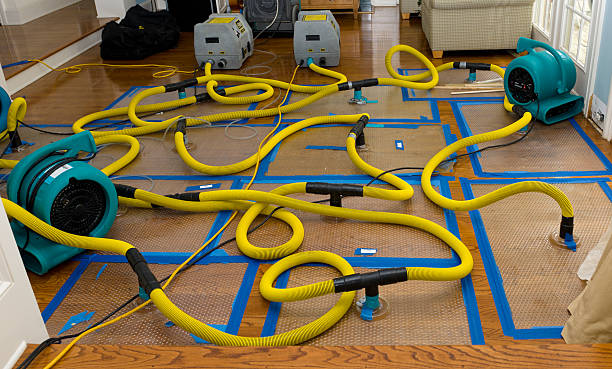 Professional Flood Damage Restoration technician working in North Kingstown, RI